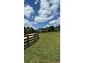 Picturesque property with fenced pastures surrounding a beautiful home, providing serene country living at 5945 Bannister Rd, Cumming, GA 30028