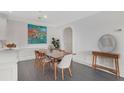 Charming dining area with modern table and chairs, colorful art, with convenient access to the kitchen and a clean aesthetic at 2499 Peachtree Ne Rd # 503, Atlanta, GA 30305