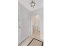 Convenient laundry room adjacent to entryway, featuring a modern washer and dryer with ample shelving for storage at 2499 Peachtree Ne Rd # 503, Atlanta, GA 30305