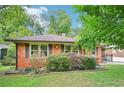 Charming brick home with a neatly landscaped front yard at 845 Stratford Rd, Avondale Estates, GA 30002