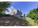 Expansive backyard featuring lush green grass and mature trees providing shade at 1892 Raven Hill Ne Dr, Atlanta, GA 30319