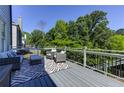 Outdoor deck features comfortable seating and a stylish rug for entertaining at 1892 Raven Hill Ne Dr, Atlanta, GA 30319