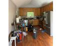 Functional kitchen with wood cabinets and stainless steel appliances at 615 Amberwood Pl, Euharlee, GA 30145