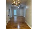 Spacious living room with hardwood floors, ceiling fan, and ample natural light at 1651 Massachusetts Sw Ave # 1, Marietta, GA 30008