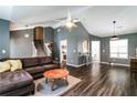 A spacious living room featuring hardwood floors, vaulted ceilings, and modern lighting fixtures for a sleek look at 2204 Dresden Nw Grn, Kennesaw, GA 30144