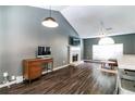 Open living room with hardwood floors, vaulted ceilings, a fireplace and lots of space at 2204 Dresden Nw Grn, Kennesaw, GA 30144