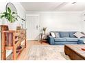 Bright living room showcases stylish furniture, hardwood flooring, and front door at 1445 Monroe Ne Dr # F18, Atlanta, GA 30324