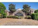 Community entrance sign for Sawgrass Estates: A Legacy and Community, brick pillars and lush landscaping at 1907 Sea Oats Dr, Hampton, GA 30228