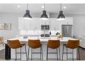 Modern kitchen with white cabinets, stainless steel appliances, and a large island at 250 Castleberry Station Sw Dr, Atlanta, GA 30313