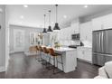 Bright, open kitchen with a center island, stainless appliances, and eat-in dining area at 250 Castleberry Station Sw Dr, Atlanta, GA 30313