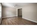 Bright living room featuring new light brown flooring and neutral paint, freshly renovated at 175 Hearth Way, Fairburn, GA 30213