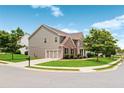 Well-maintained home on a corner lot with green lawn, mature trees, and attached two-car garage at 3366 Bridge Walk Dr, Lawrenceville, GA 30044