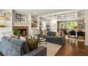 Bright living room with fireplace, custom built-ins and access to dining area at 2554 Saint Patrick Se St, Atlanta, GA 30317