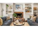 Cozy living room featuring a fireplace, built-in shelving, and stylish decor at 2554 Saint Patrick Se St, Atlanta, GA 30317