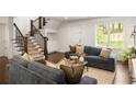 Comfortable living area with staircase, neutral decor, and plenty of natural light at 2554 Saint Patrick Se St, Atlanta, GA 30317