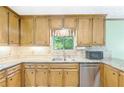 Kitchen featuring stainless steel appliances, granite countertops, and tiled backsplash at 3625 Stonehenge Ne Way, Marietta, GA 30066
