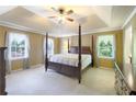 Spacious bedroom with trey ceiling, plush carpet, and large windows for natural light at 3625 Stonehenge Ne Way, Marietta, GA 30066