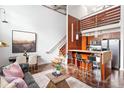 Bright open floor plan boasting exposed ceilings, hardwood floors, a stylish kitchen and a loft at 964 Dekalb Ne Ave # 112, Atlanta, GA 30307