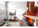 Comfortable living room with a leather sofa, chic decor, and lots of natural light at 964 Dekalb Ne Ave # 112, Atlanta, GA 30307