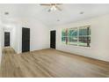 Open living room with hardwood floors, vaulted ceiling, and natural light at 102 Aristocratic Way, Locust Grove, GA 30248