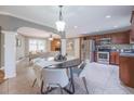 Eat-in kitchen with stainless steel appliances, dark wood cabinets, and tile flooring at 2279 Parkview Cir, College Park, GA 30337