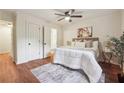 Serene bedroom with natural light, complemented by modern decor and a ceiling fan at 3708 Canadian Way, Tucker, GA 30084
