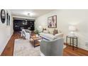 Comfortable living room with plush seating, stylish decor, and hardwood floors at 3708 Canadian Way, Tucker, GA 30084