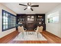 Cozy living room featuring dark built-in bookshelves and a decorative fireplace at 3708 Canadian Way, Tucker, GA 30084