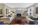 Cozy living room showcasing a fireplace, built-in shelving, and neutral tones at 407 River Mill Cir # 407, Roswell, GA 30075