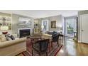 Comfortable living room with fireplace, hardwood floors, and natural light at 407 River Mill Cir # 407, Roswell, GA 30075