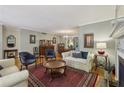 Spacious living room with hardwood floors, fireplace, and elegant furnishings at 407 River Mill Cir # 407, Roswell, GA 30075
