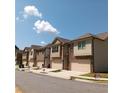 Row of modern townhomes with neat landscaping and 'Open House' signs at 101 Dewey Rd, Lilburn, GA 30047