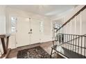 Welcoming foyer with hardwood floors, staircase, and a bench at 1080 Northshore Dr, Roswell, GA 30076