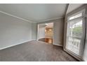 Cozy living room with large windows and trim at 2001 Fairbrook Ln, Woodstock, GA 30189