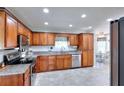 Well-equipped kitchen with granite countertops, stainless steel appliances, and ample cabinet space at 1621 Dixie Rd, Covington, GA 30014