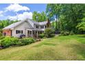 Spacious backyard with a patio area, perfect for outdoor entertaining and relaxation at 4930 Forestglade Ct, Tucker, GA 30087