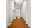 Inviting entryway with hardwood floors and arched doorway leading to the living space at 2647 Sardis Chase Ct, Buford, GA 30519