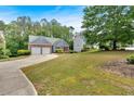 Beautiful single-Gathering home with two-car garage and expansive green lawn at 10 Bayberry Ct, Acworth, GA 30101