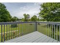 View from the back deck with grey wooden rails overlooking a spacious grassy yard at 2821 Highway 11, Mansfield, GA 30055
