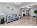 Bright living room features hardwood floors, a comfortable couch, and decorative accents at 1819 Waldrep Se Cir, Marietta, GA 30060