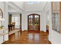 Spacious foyer with gleaming hardwood floors and high ceilings at 2325 Manor Creek Ct, Cumming, GA 30041