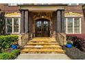 Inviting entryway with stone steps and elegant double doors at 2325 Manor Creek Ct, Cumming, GA 30041