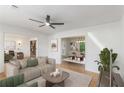 Bright living room featuring hardwood floors, neutral tones and ceiling fan at 201 E Simon Nw Ter, Atlanta, GA 30318