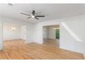 Spacious living area with wood floors, a ceiling fan, and an open layout at 201 E Simon Nw Ter, Atlanta, GA 30318