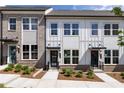 Up close exterior view featuring the brick and siding detail of the townhomes, and the professionally landscaped yards at 357 Skylar Se Ct, Atlanta, GA 30315
