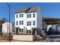 Exterior view of newly constructed townhomes with large windows and well-maintained landscaping at 357 Skylar Se Ct, Atlanta, GA 30315