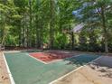 Outdoor basketball court surrounded by trees at 219 Eagles Landing Way, Mcdonough, GA 30253