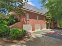 Brick home with a three-car garage and an outdoor basketball court at 219 Eagles Landing Way, Mcdonough, GA 30253