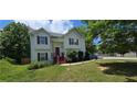 Traditional home with well-manicured lawn and mature shade trees at 8436 Cyprus Ridge Way, Douglasville, GA 30134