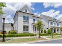 Beautiful two-story house showcases pristine landscaping, inviting curb appeal, and timeless design elements at 1023 Harvest Park Ln, Suwanee, GA 30024